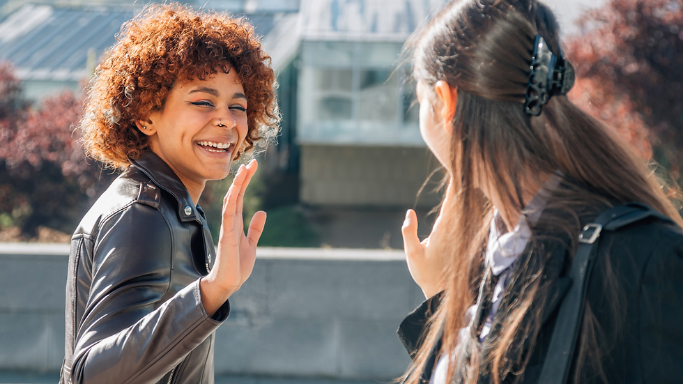 two people waving goodbye at each other