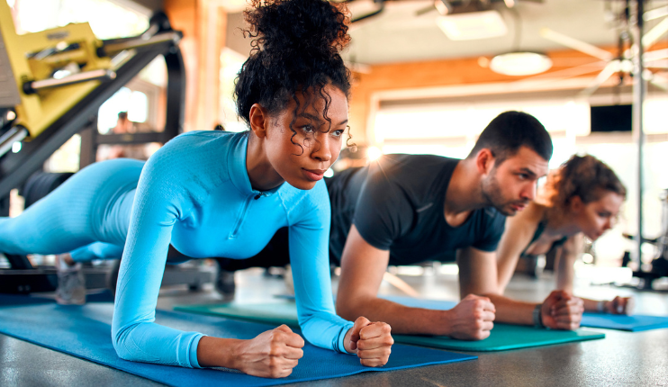 diverse people exercising on the gym