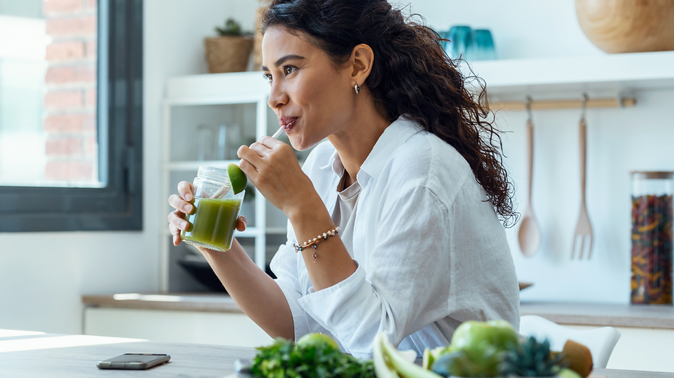 lady drinking green smoothie healthy living