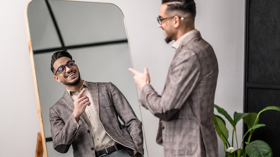 man talking to himself in the mirror