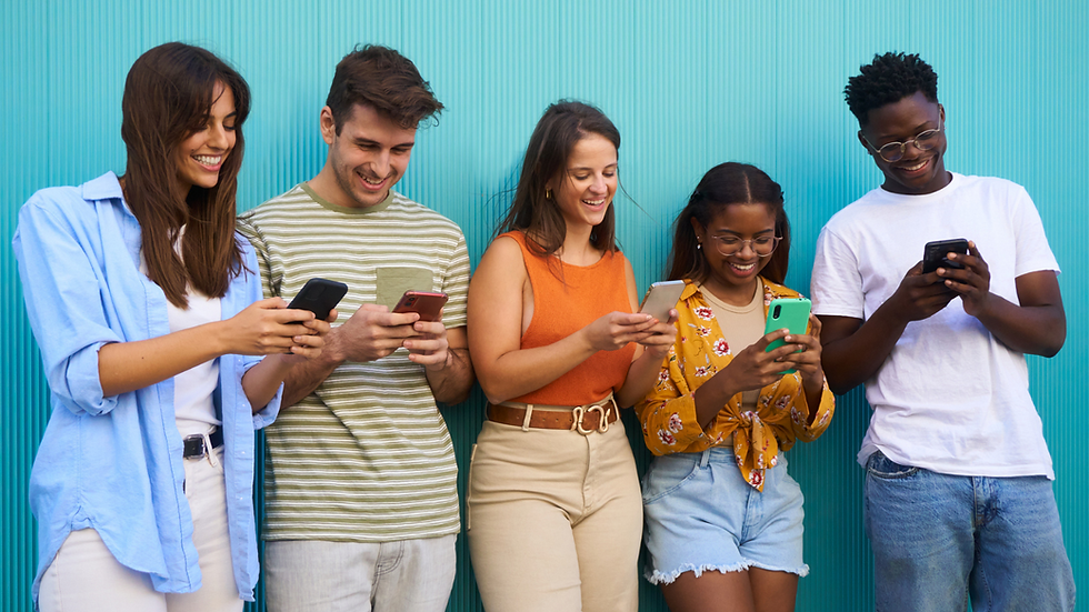diverse group of people holding smartphones