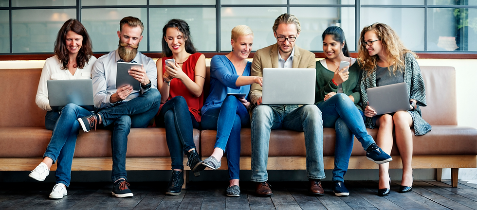 Diverse group of people using electronic devices